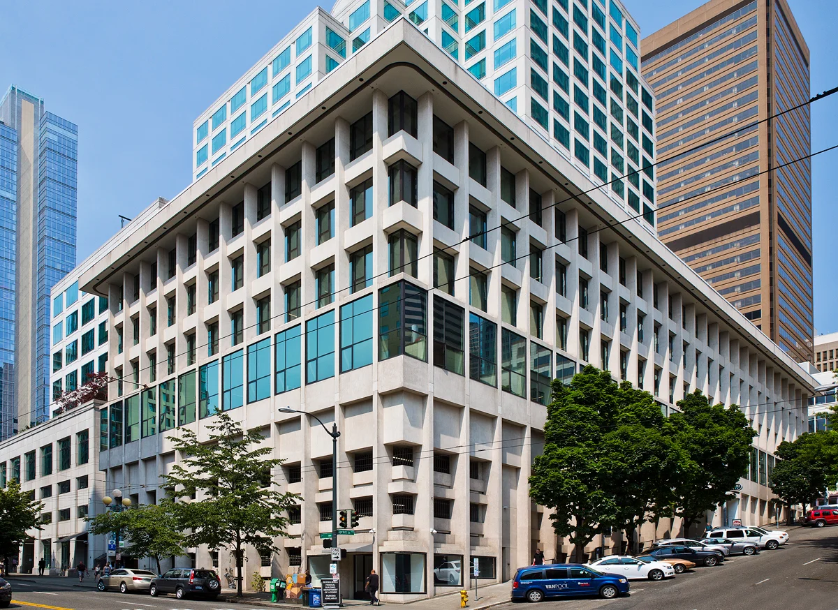Office building at 1101 Second Avenue in Seattle with white concrete facade featuring recessed windows