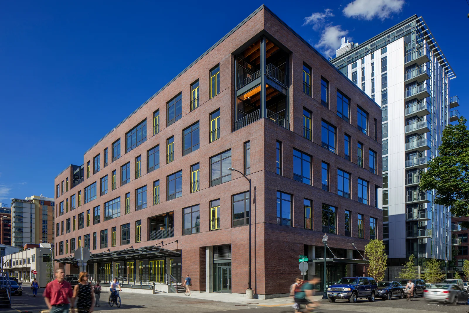 Heartline modern brick building at 850 Northwest Thirteenth Street in Portland with open corner grid and exposed structural beams