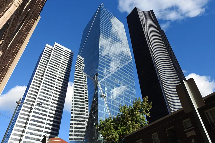 F5 Tower modern office building at 801 Fifth Avenue in Seattle with distinctive angled blue glass facade