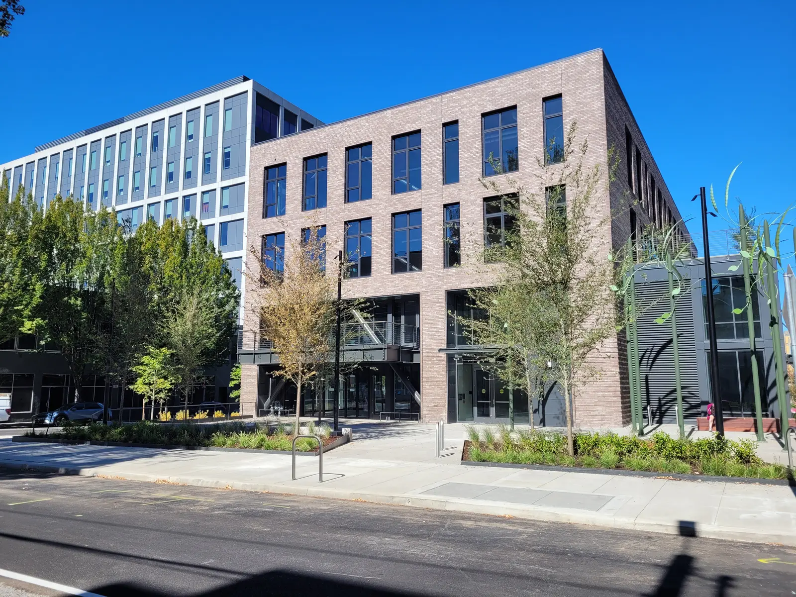 Exterior view of Plaza Building at Press Blocks at 1621 SW Taylor Street in Portland featuring industrial design and large gathering spaces.