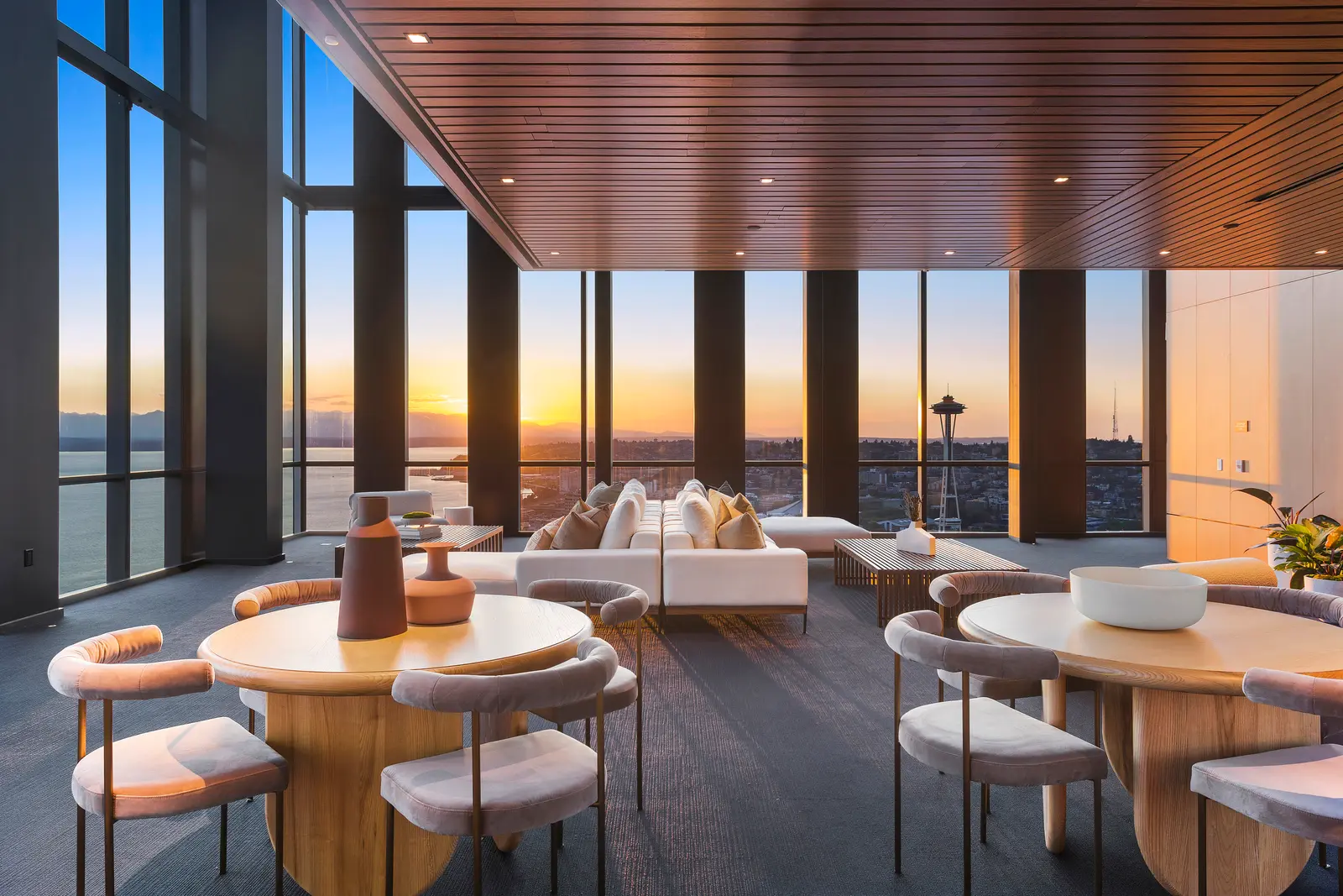 Resident lounge of The Modern at 255 Lenora Street in Seattle featuring views of Elliott Bay and the city skyline from the 35th floor.